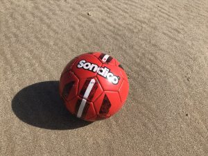 A Football on a beach