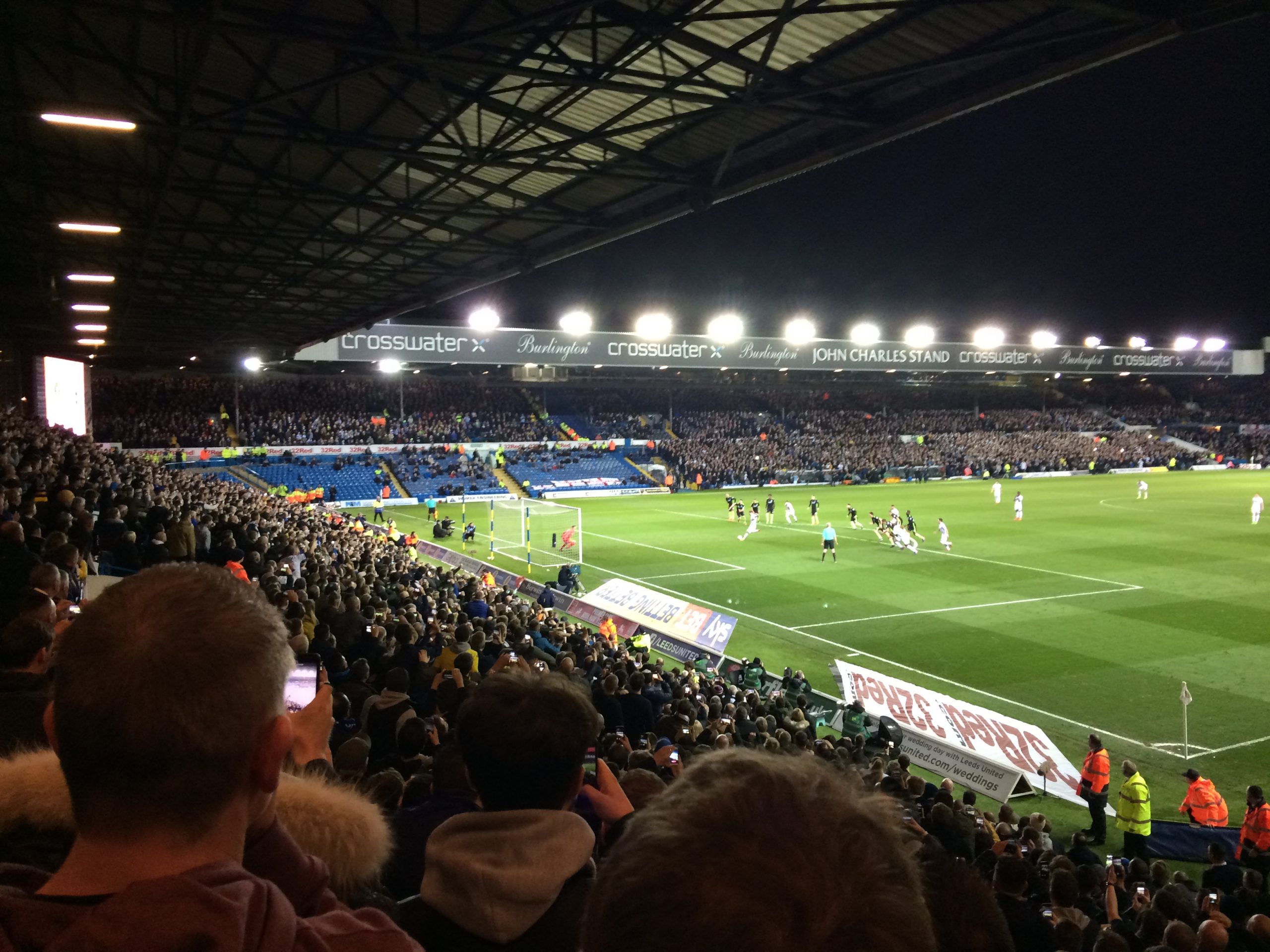 Floodlit action from a football stadium