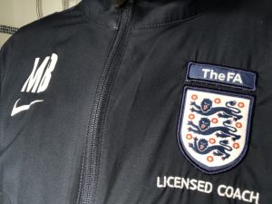 A licensed football coach jacket